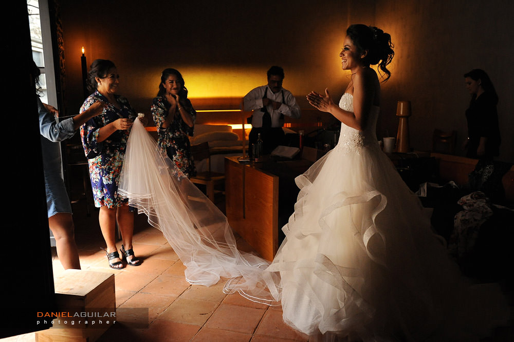 Happy bride with a nice moment with her family in getting ready room