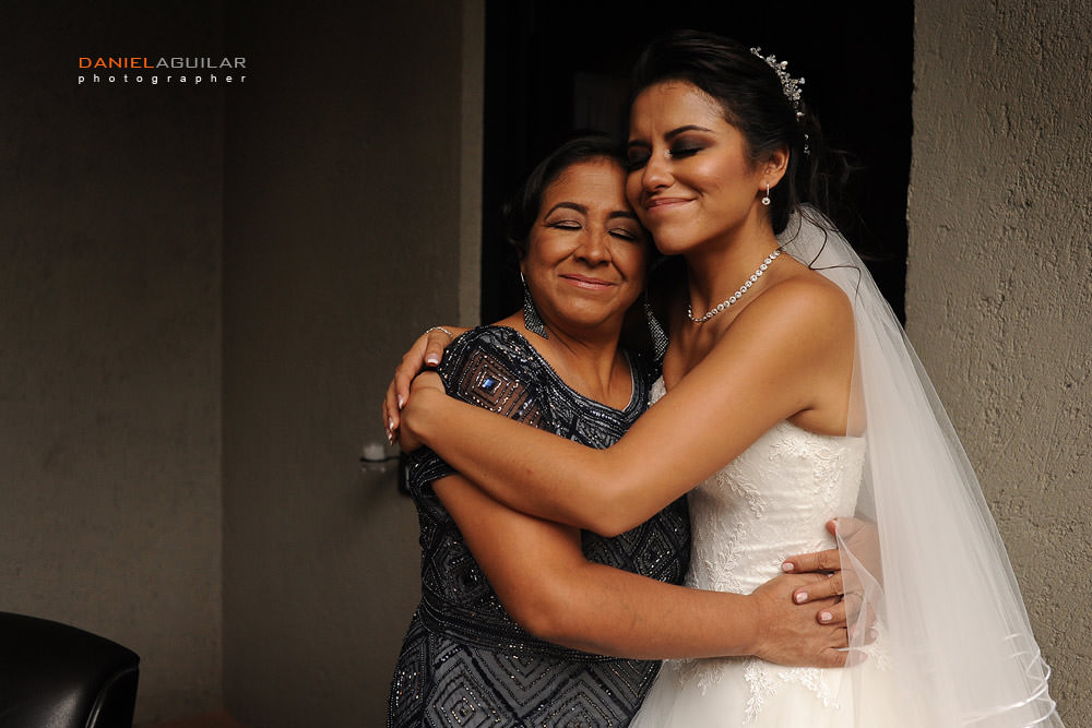 mom and bride have a tender moment