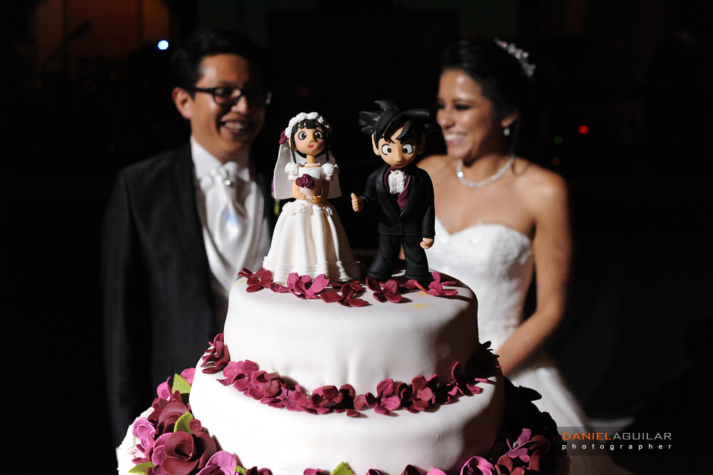 a wedding cake with goku as a cake top